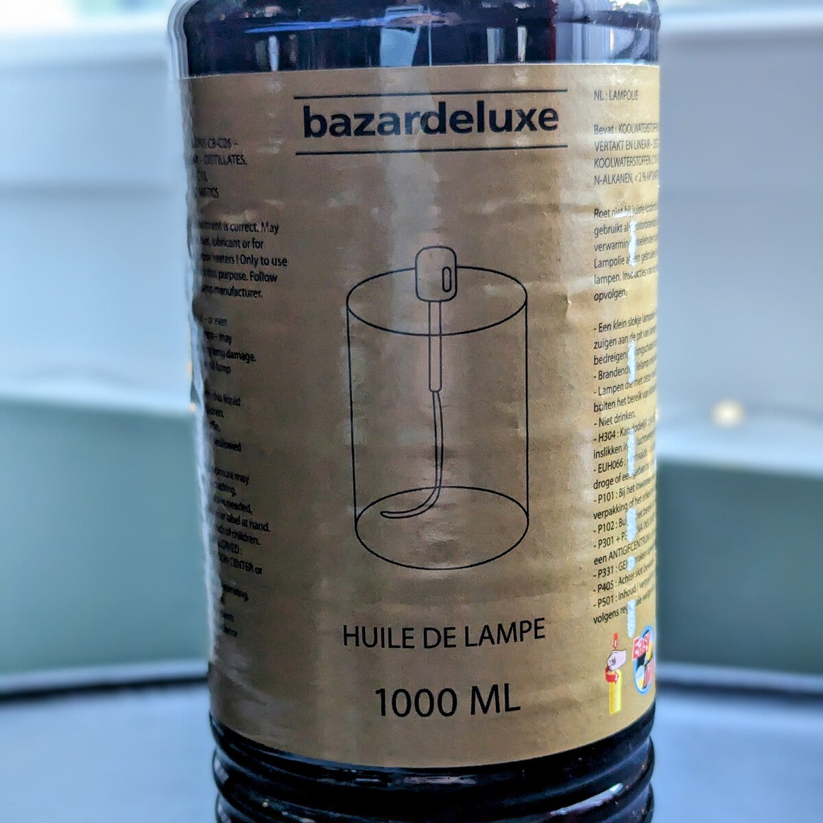 bouteille d'huile de parafine 1 litre  translucide et sans odeur, avec un bec verseur pour lampe à huile