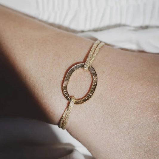 bracelet élastique doré avec une pièce de 10 francs plaquée or 18 carats